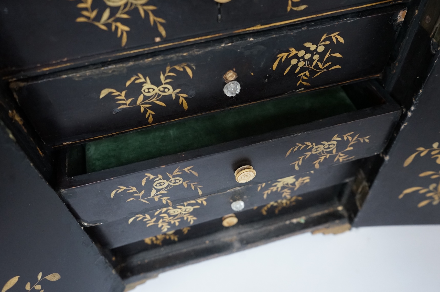 A mid 19th century Chinese export gilt-decorated lacquer two door cabinet, with five drawers, 38cm